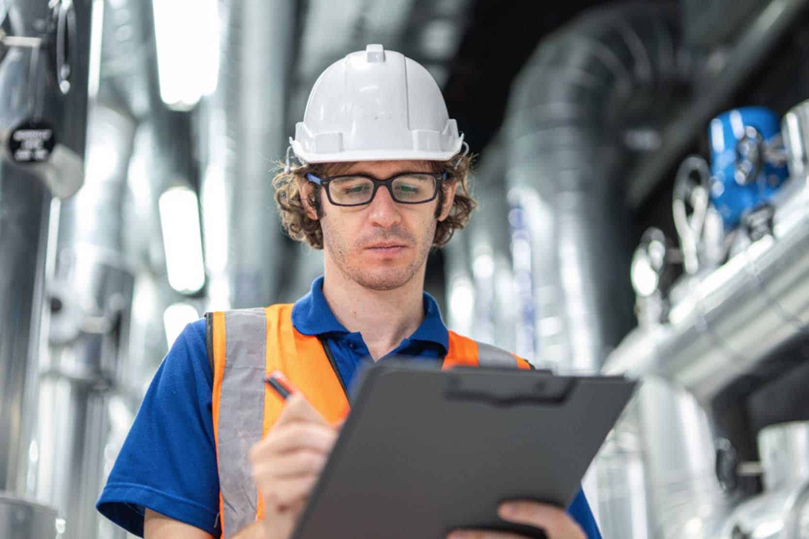 A completed pipe repair with a checklist on a clipboard nearby