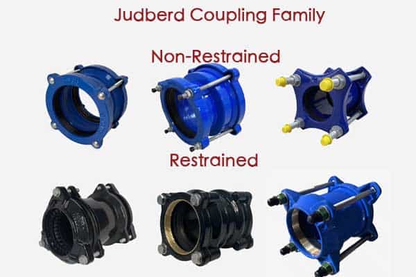 A selection of different pipe couplings on a workshop bench