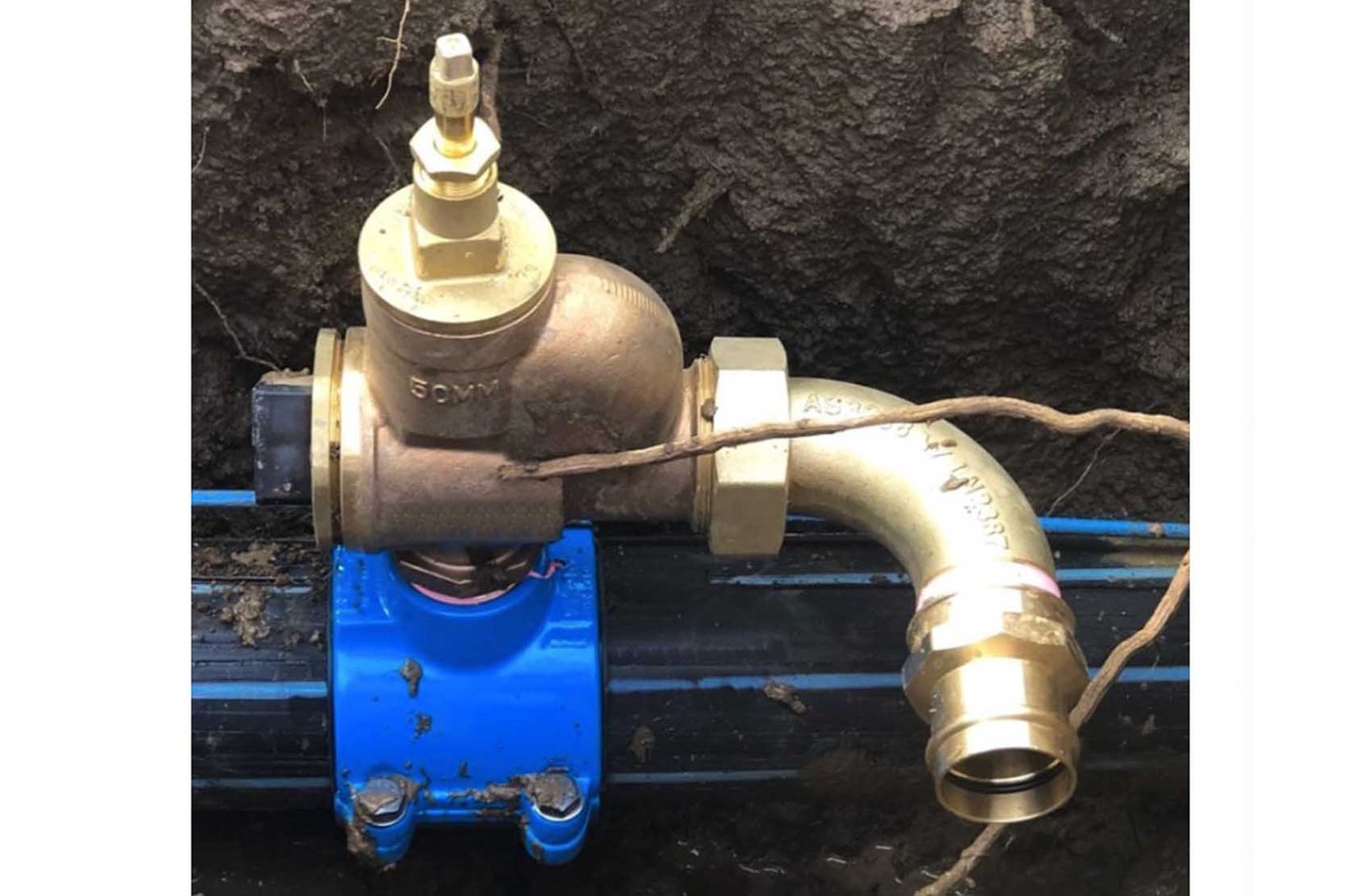 close-up of a secure saddle clamp on hdpe pipe