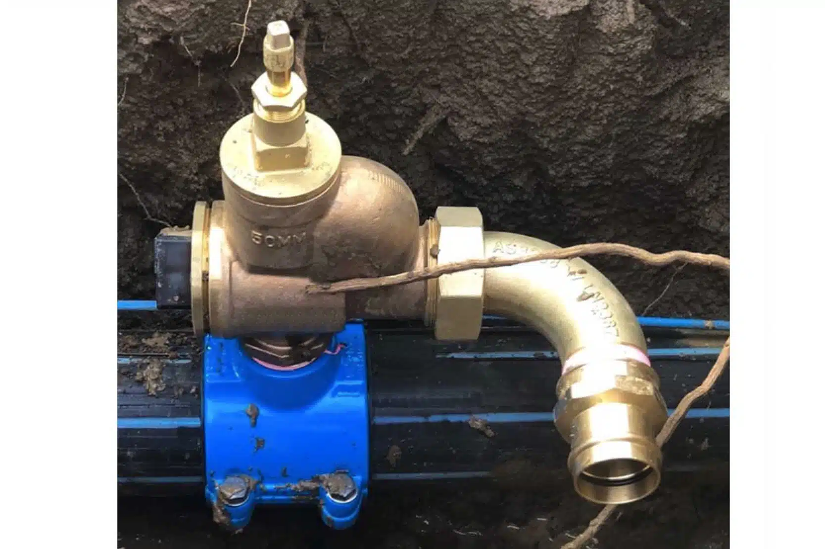 close-up of a secure saddle clamp on hdpe pipe