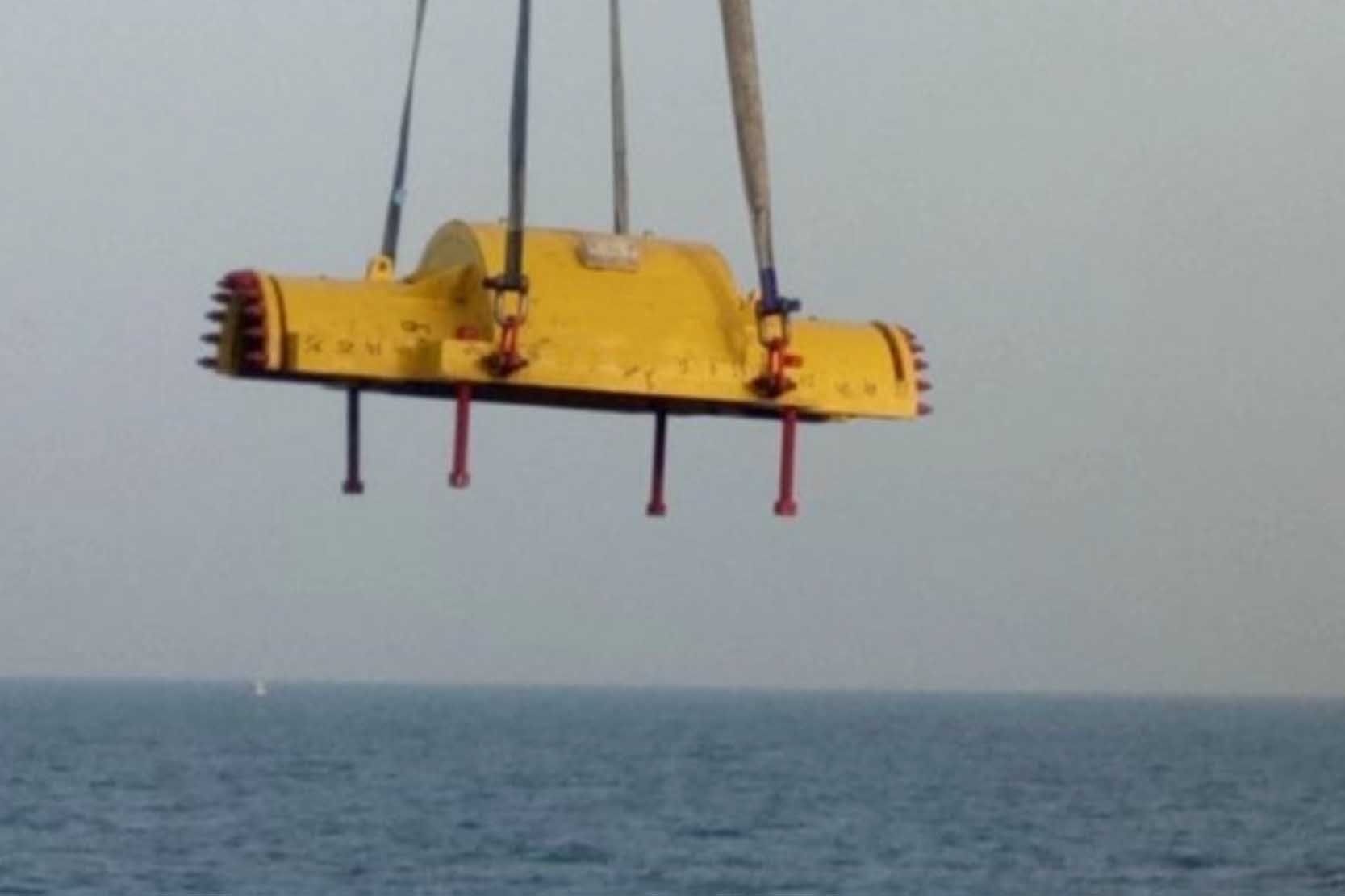 A heavy-duty split sleeve being installed on a large pipe